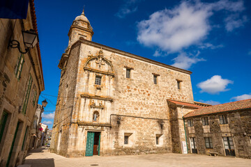 Fototapeta na wymiar Melide, Galicia, Spain. Milestone in the Camino de Santiago route. View of the exterior of Saint Peter church