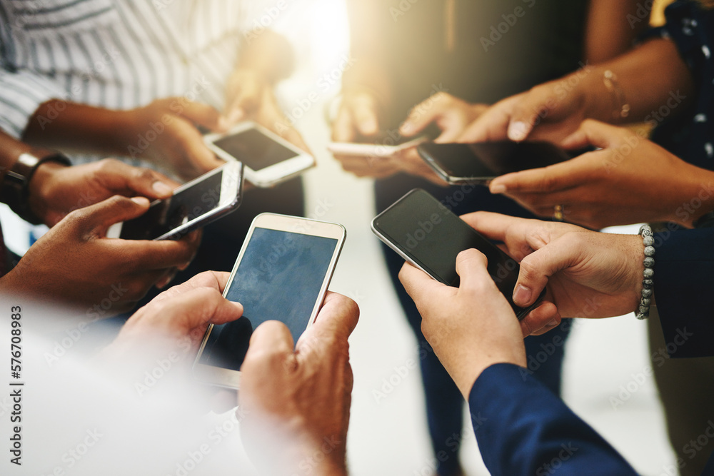 Aufkleber Theres no faster way to spread the word than online. Closeup shot of a group of unrecognizable businesspeople using their cellphones in synchronicity.