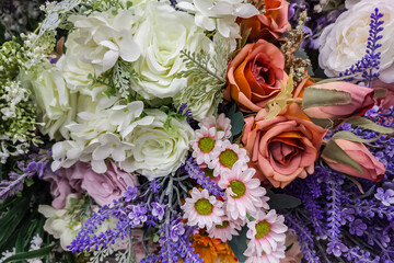 Background with artificial flowers.