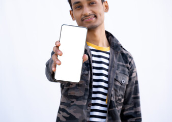 Indian Teenage boy Showing mobile with white Screen, Boy Smiling face in White background