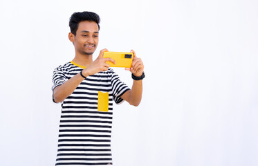  Teenage Boy taking photos and smiling expressions, taking photos with Orange mobile phone