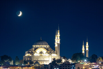 Islamic or ramadan concept photo. Suleymaniye Mosque and crescent moon.