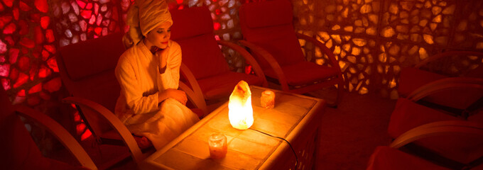 Beautiful young woman enjoying salt therapy and beauty treatment in a beauty spa