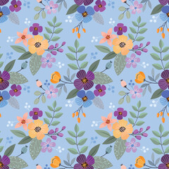 Flowers and leaf design on blue background seamless pattern.