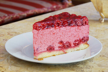 Raspberry mousse cake with a sponge base.