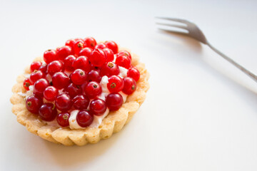 Tartlet with currants. Dessert with red fruits such as raspberries, strawberries, blackberries or blueberries.
