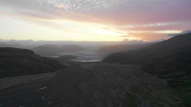 Aerial view of Hoffellsfjoll Glacier at sunset with a valley in foreground in Eastern region, Iceland.