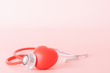 Red heart with doctor physician's stethoscope, World heart health day, doctor day.