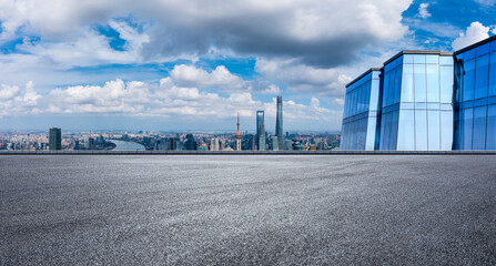 Asphalt road platform and modern city skyline with buildings scenery in Shanghai, China.