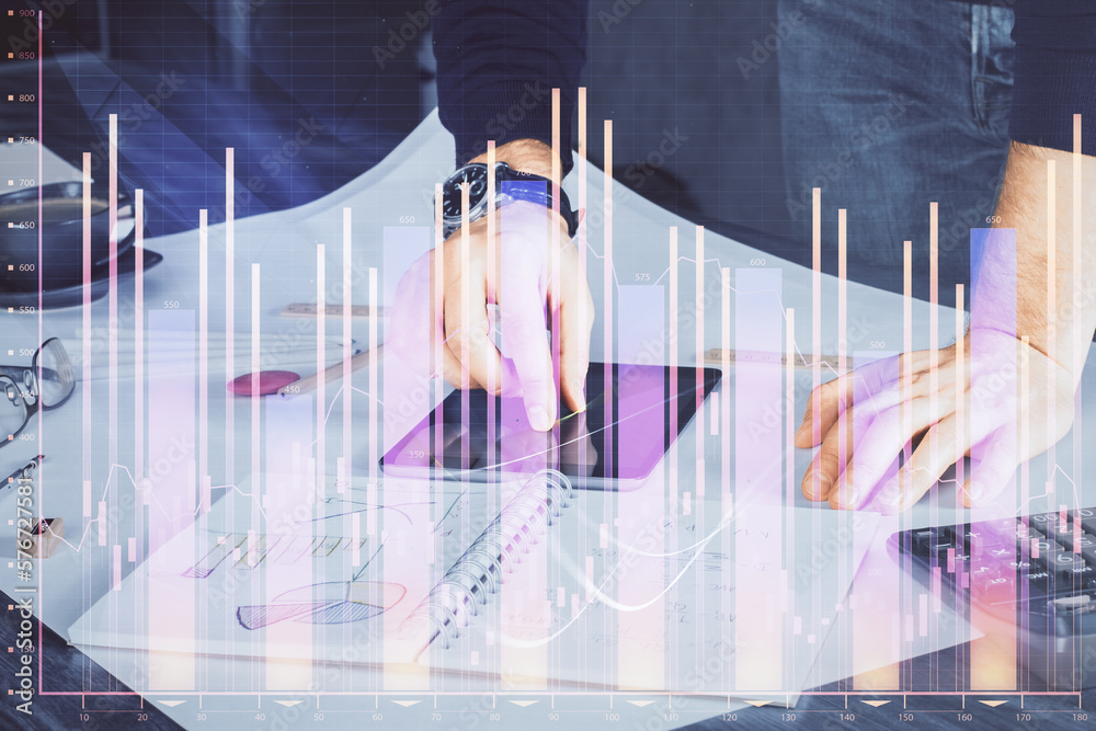Poster double exposure of man's hands holding and using a digital device and forex graph drawing. financial