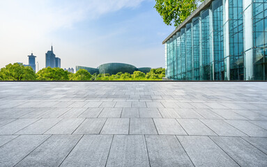 Empty square floor and city skyline with modern buildings in Shanghai, Zhejiang Province, China. - obrazy, fototapety, plakaty
