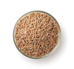Top view of spelt wheat grains in glass bowl