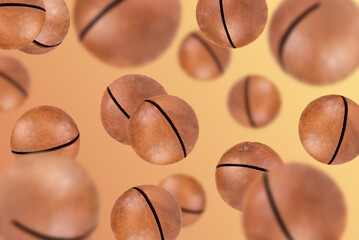 Levitation of macadamia nuts on a brown background.