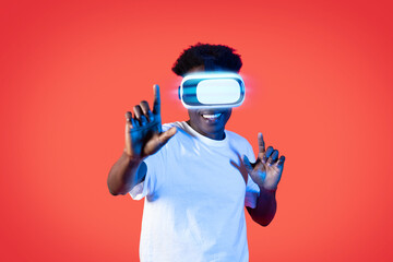 Happy black guy using VR headset, virtual reality concept