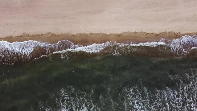 surf of the waves of the black sea. Wild beach. aerial