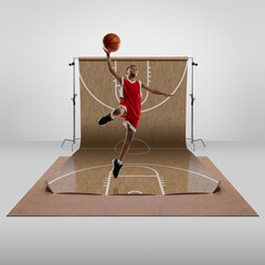 Slam dunk. Teen boy, professional basketball player in uniform, training, playing over sports...