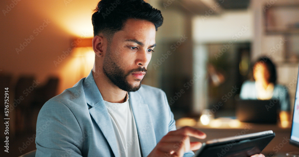Poster confident business planning a marketing strategy on a digital tablet while working in a modern offic