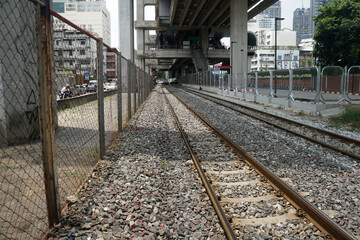 Fototapeta premium train tracks, railroad tracks, railway are under the expressway in Thailand.