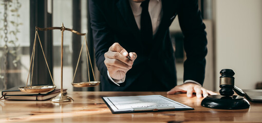 lawyer working with contract agreement at table office, law and justice concept, Selective focus.