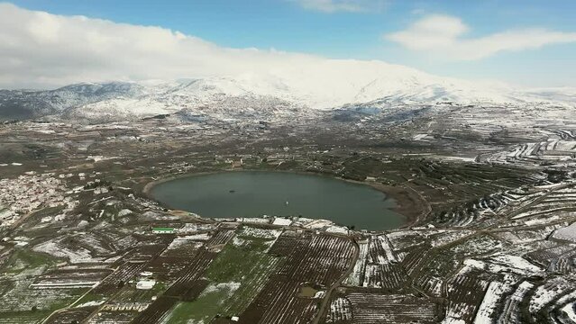 Israel Hermon mountain covered with snow and Ram lake, Drone footage
