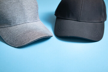 Baseball cap on the blue background.