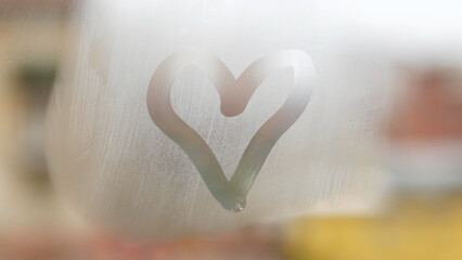 A Heart Symbol Drawn on a Window Glass