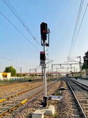 Catenary wires suspended above the tracks form a network of systems that supply electricity to...