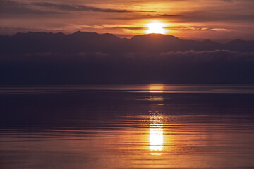 Sunrise with sea and mountains, landscape - 576772744