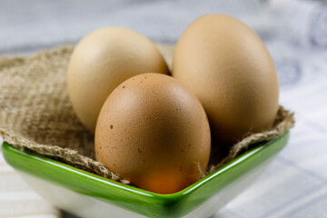 Boiled eggs on linen fabric in a bowl
