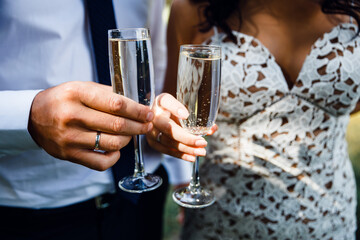 person holding a glass of champagne