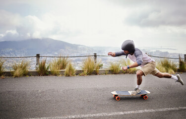 Skateboard, action and man in road for sports competition, training and exercise in urban city....