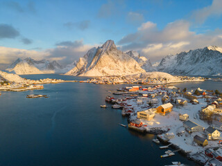 Fototapeta premium White snow mountain in Lofoten islands, Nordland county, Norway, Europe. Hills and trees, nature landscape in winter season. Winter background.