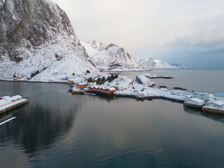 White snow mountain in Lofoten islands, Nordland county, Norway, Europe. Hills and trees, nature landscape in winter season. Winter background.