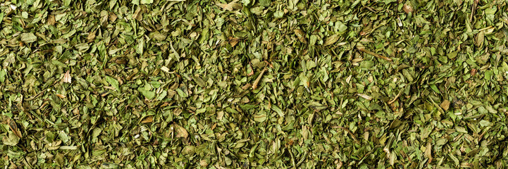 Dried lovage texture. Background with copyspace. Close up. Top view