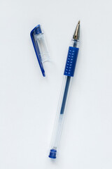 Blue gel pen with open pen cap on white background.