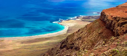 Poster amazing nature scenery of Lanzarote island, popular spot Mirador del Rio with breathtaking view for Grasiosa island in northern part. Canary islands © Freesurf