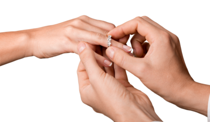 Close up Groom Putting the Wedding Ring on bride's finger