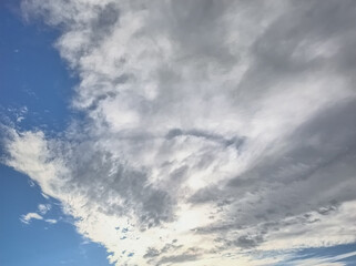 Massive cloud that has wings flying in sun direction