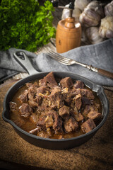 Beef stew in a cast iron skillet.