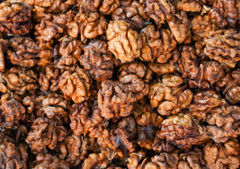 Big shelled walnuts background texture.