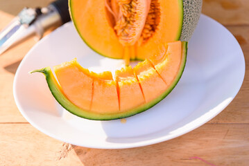 a lot of piece of fresh orange melon on the plate