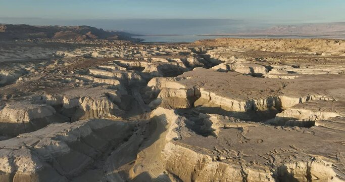 Aerial footage of river Pratsim in the Amiaz plain near the Dead Sea and Mount Sodom before sunset