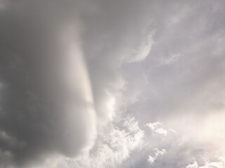 Rare clouds, gray and white rare clouds. White clouds being illuminated. Bright light
