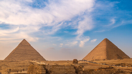 Fototapeta na wymiar General panoramic view of pyramids with Sphinx in Giza, Cairo, Egypt. Real view from the front.