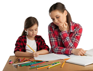 Happy young mother and daughter painting