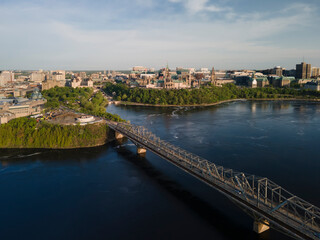 Obraz premium Aerial drone panoramic view of city of Ottawa Alexandra bridge over the Ottawa river and city skyline.