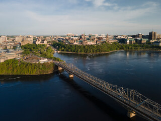 Fototapeta na wymiar Aerial drone panoramic view of city of Ottawa Alexandra bridge over the Ottawa river and city skyline.