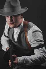American gangster from Chicago. Early 20th century. Hat and formal suit of shirt and vest. Armed...
