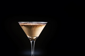 chocolate martini with coffee on isolated black background. alcoholic drink with milk, chocolate...