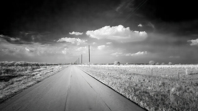 Straight flat road with telephone poles in rural Central Florida USA © Jim Schwabel